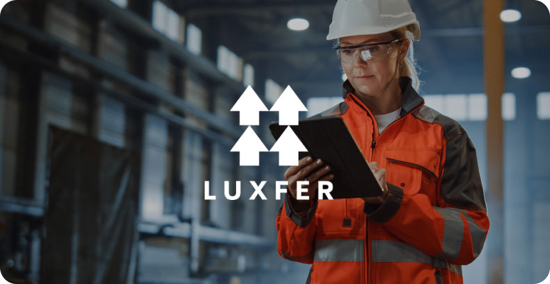 Gas engineer checking paperwork with luxfer gas logo overlay